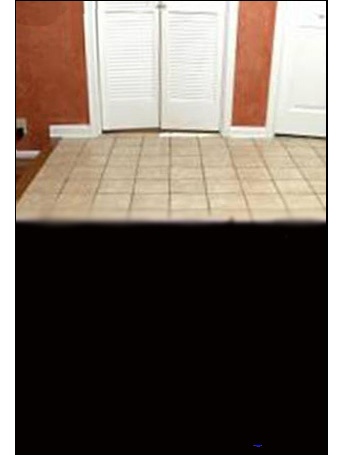 Photo shows the same scene as the last photo, but there is a purple surface (occlusion) held up that blocks our view of the cane and the box (a sliver of the furthest corner of the box is barely visible beyond the occlusion).