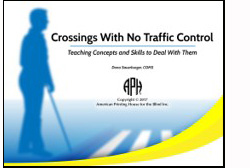 Front cover of APH program shows a silhouetted man using a long cane walking along a crosswalk
