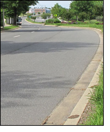6 photos show a car and a bus approaching from where the street disappears.  The car stays in the nearest lane so we never lose sight of it, but the bus is in the farthest lane and it disappears behind the trees, then appears again when it is about 50 feet from us.