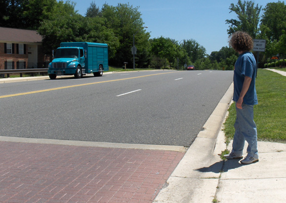 Photo shows the blue truck near the crosswalk in front of Stephan.